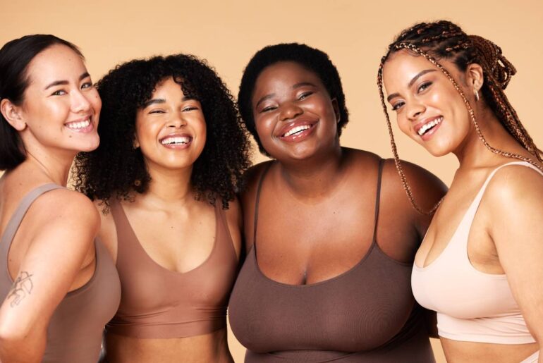 Friends, diversity and beauty of women in underwear in studio isolated on a brown background. Portr.